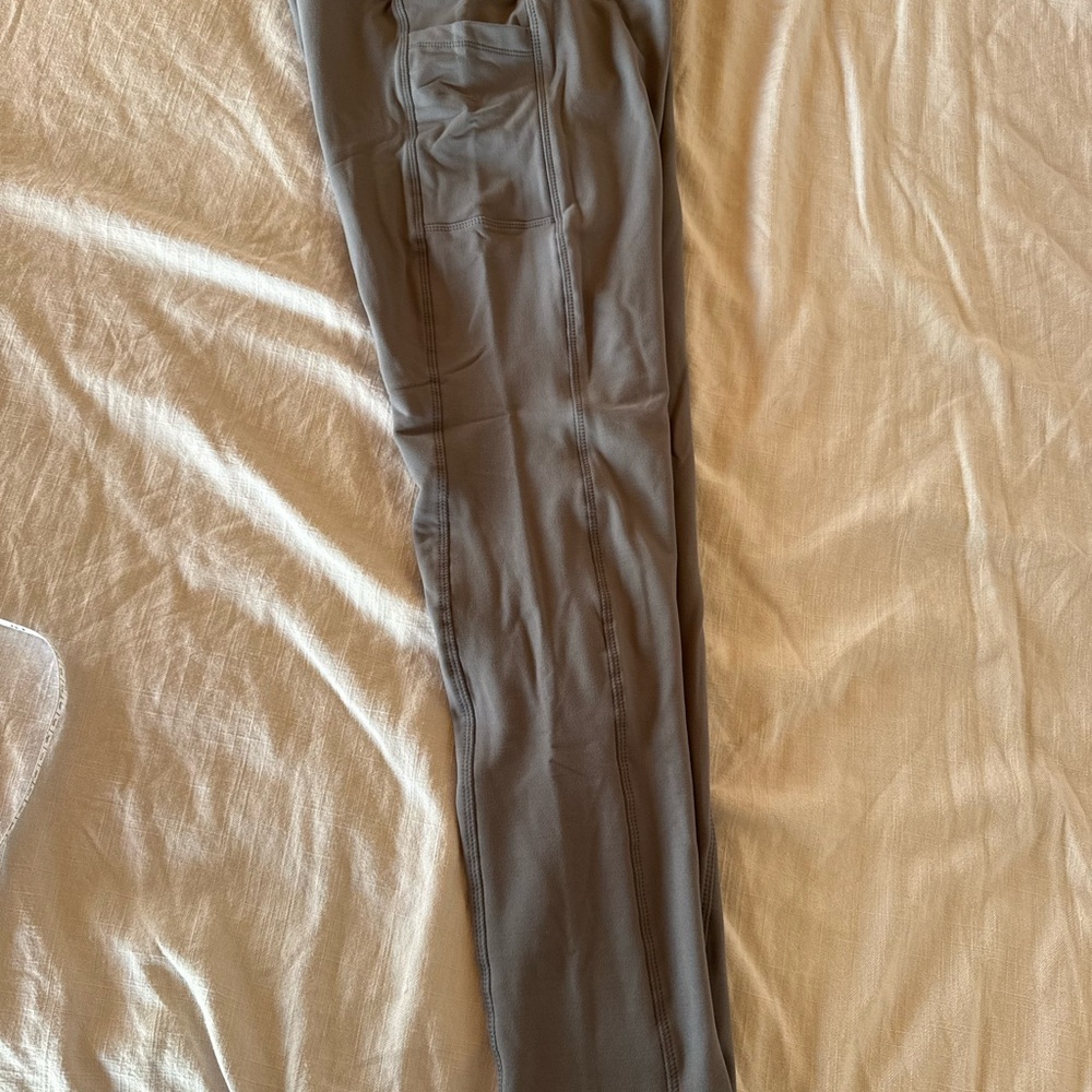 2 pairs of Women's Gray and Navy Fleeced lined Leggings. New in package
